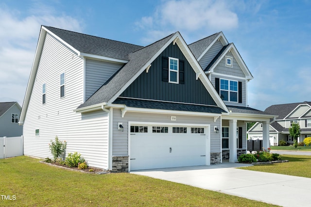 3206 Dandelion Dr, Grimesland, NC 27837 - craftsman house featuring board and batten siding, driveway, a shingled roof, and stone siding