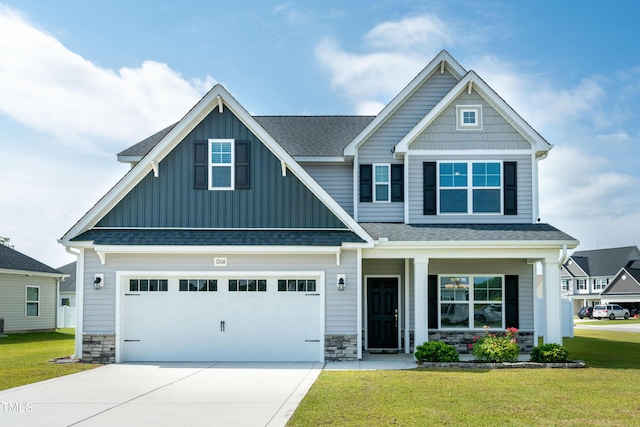 3206 Dandelion Dr, Grimesland, NC 27837 - craftsman inspired home featuring board and batten siding, covered porch, a front lawn, and driveway