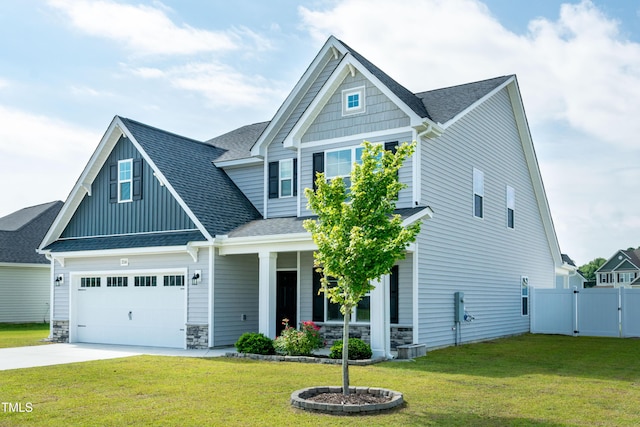 3206 Dandelion Dr, Grimesland, NC 27837 - craftsman-style house featuring a porch, concrete driveway, board and batten siding, a gate, and a shingled roof