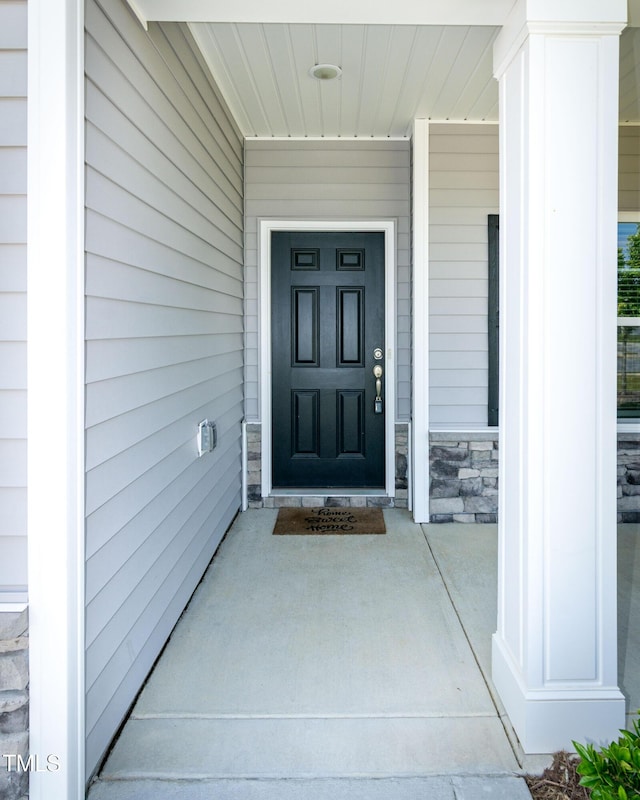 3206 Dandelion Dr, Grimesland, NC 27837 - property entrance with stone siding and covered porch