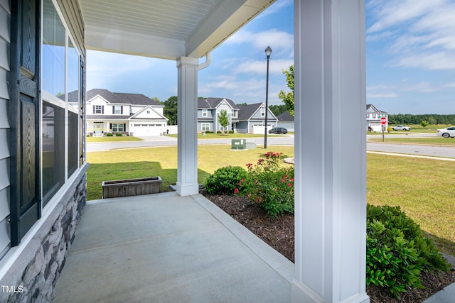 3206 Dandelion Dr, Grimesland, NC 27837 - porch featuring a residential view and a yard
