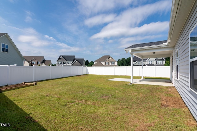 3206 Dandelion Dr, Grimesland, NC 27837 - fenced backyard with a patio area and a residential view