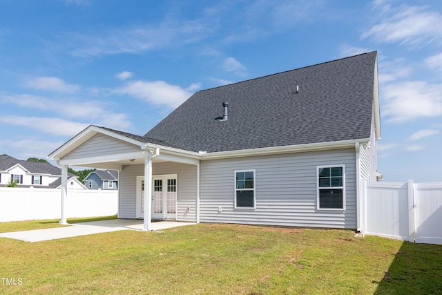 3206 Dandelion Dr, Grimesland, NC 27837 - back of house featuring french doors, a patio, concrete driveway, an attached carport, and roof with shingles