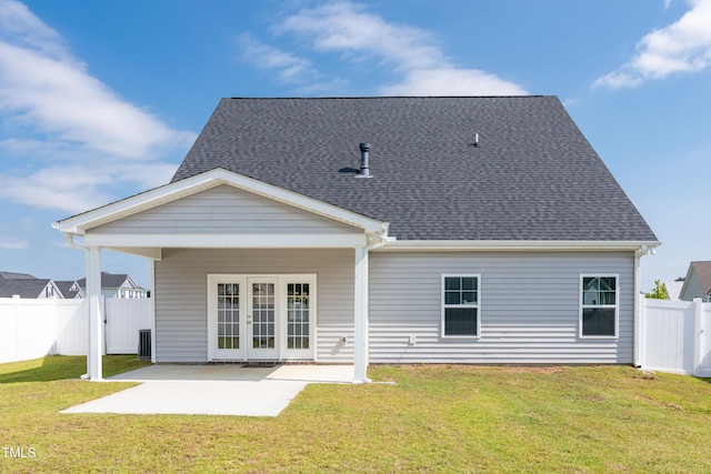 3206 Dandelion Dr, Grimesland, NC 27837 - rear view of house with french doors, a patio area, a fenced backyard, and a shingled roof