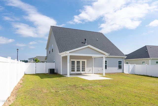 3206 Dandelion Dr, Grimesland, NC 27837 - back of house featuring french doors, a patio area, a fenced backyard, and roof with shingles