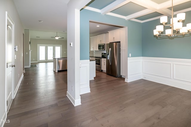 3206 Dandelion Dr, Grimesland, NC 27837 - kitchen with appliances with stainless steel finishes, open floor plan, white cabinets, a chandelier, and dark wood-type flooring