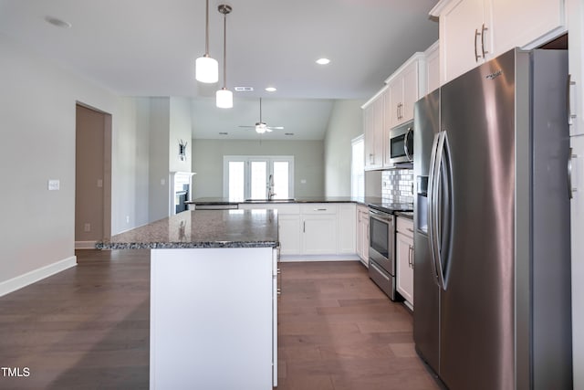 3206 Dandelion Dr, Grimesland, NC 27837 - kitchen with stainless steel appliances, a peninsula, white cabinets, a ceiling fan, and recessed lighting