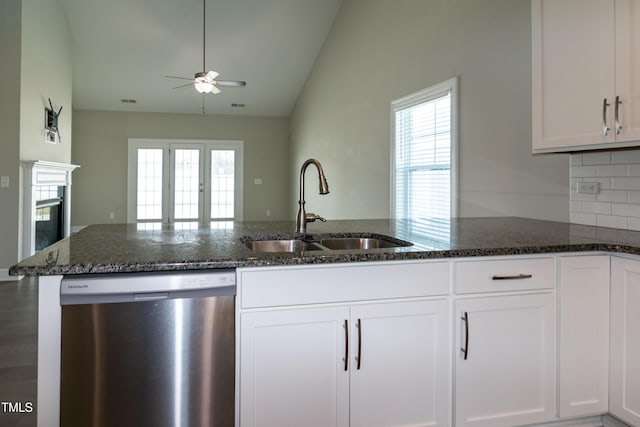 3206 Dandelion Dr, Grimesland, NC 27837 - kitchen featuring dishwasher, a ceiling fan, lofted ceiling, dark stone counters, and white cabinetry