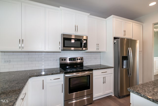 3206 Dandelion Dr, Grimesland, NC 27837 - kitchen featuring stainless steel appliances, white cabinets, decorative backsplash, dark stone counters, and recessed lighting