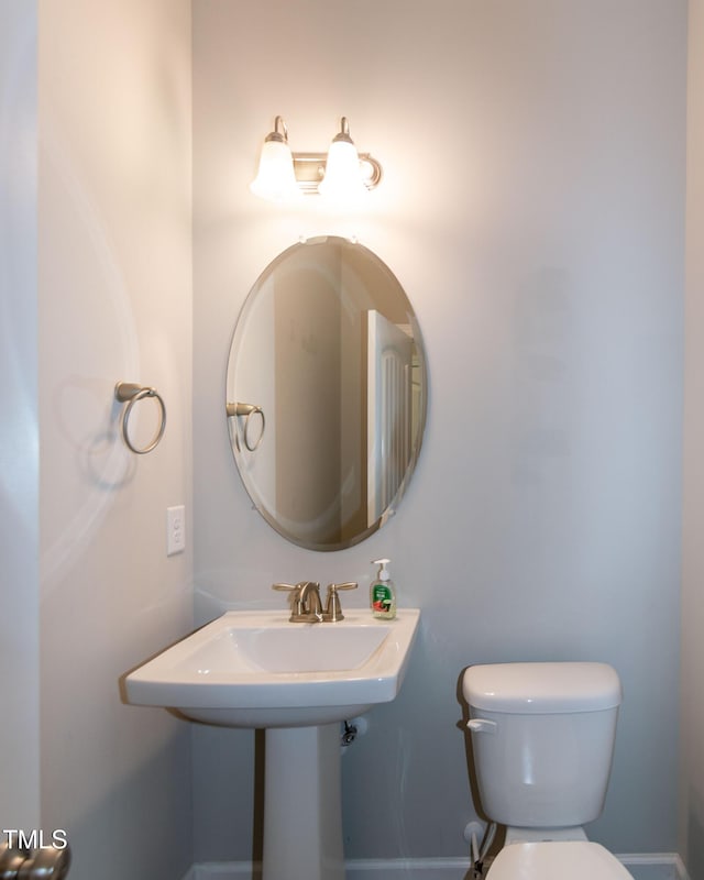 3206 Dandelion Dr, Grimesland, NC 27837 - bathroom with toilet and a sink