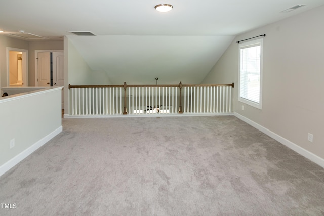 3206 Dandelion Dr, Grimesland, NC 27837 - additional living space with lofted ceiling, carpet, and attic access