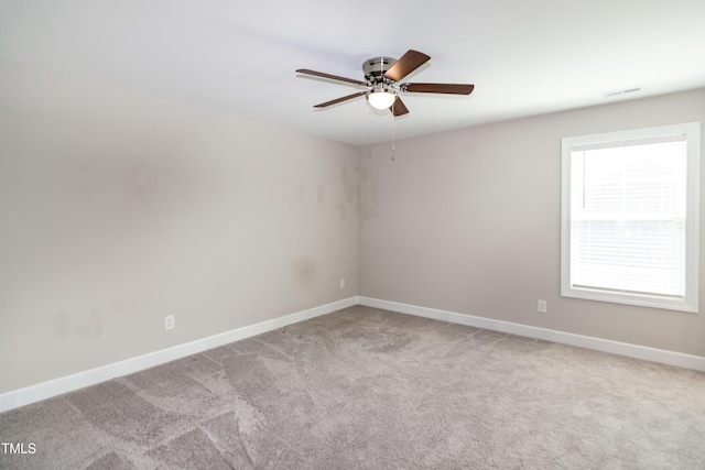 3206 Dandelion Dr, Grimesland, NC 27837 - spare room with ceiling fan and light colored carpet