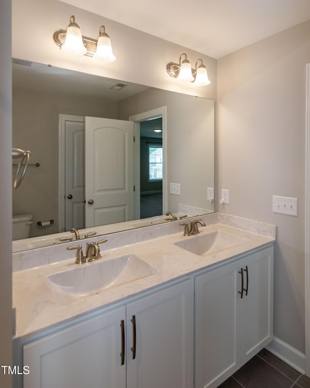 3206 Dandelion Dr, Grimesland, NC 27837 - bathroom with double vanity and tile patterned floors