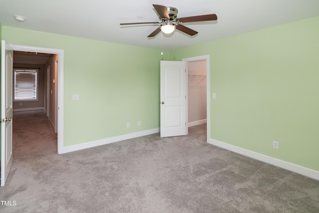 3206 Dandelion Dr, Grimesland, NC 27837 - unfurnished bedroom featuring carpet floors, a spacious closet, a closet, and ceiling fan