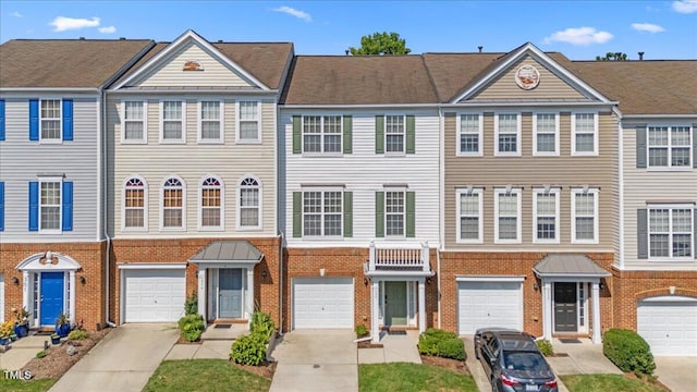 309 Ruby Walk Dr, Morrisville, NC 27560 - multi unit property with brick siding, driveway, an attached garage, and a standing seam roof