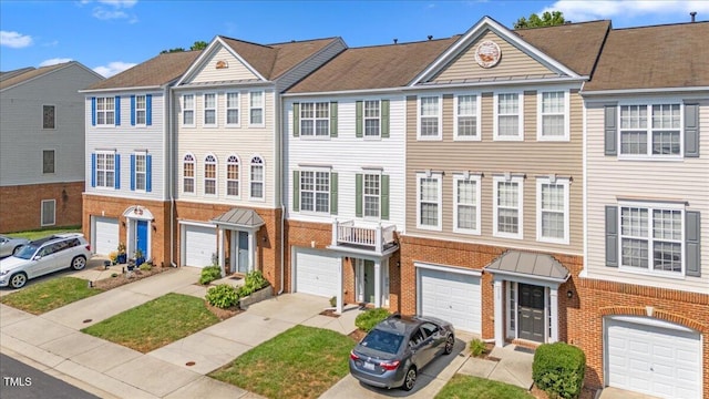 309 Ruby Walk Dr, Morrisville, NC 27560 - multi unit property featuring brick siding, an attached garage, driveway, and a standing seam roof