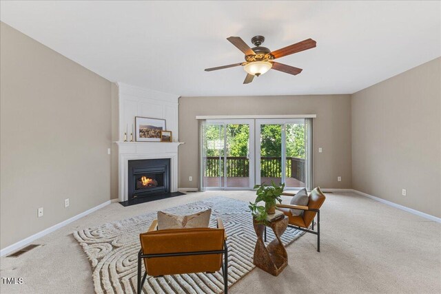 309 Ruby Walk Dr, Morrisville, NC 27560 - living area with light carpet, a ceiling fan, and a fireplace
