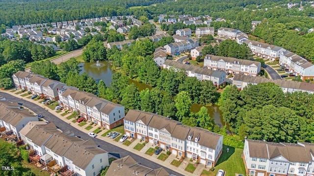 309 Ruby Walk Dr, Morrisville, NC 27560 - aerial view of residential area with a nearby body of water and a forest