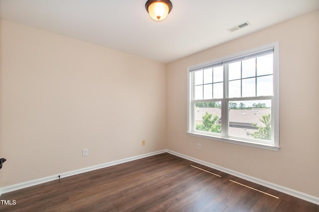 10119 Glen Autumn Rd, Raleigh, NC 27617 - spare room featuring baseboards and dark wood-type flooring