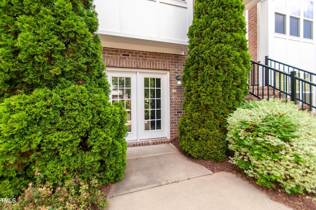 10119 Glen Autumn Rd, Raleigh, NC 27617 - view of exterior entry with brick siding and french doors