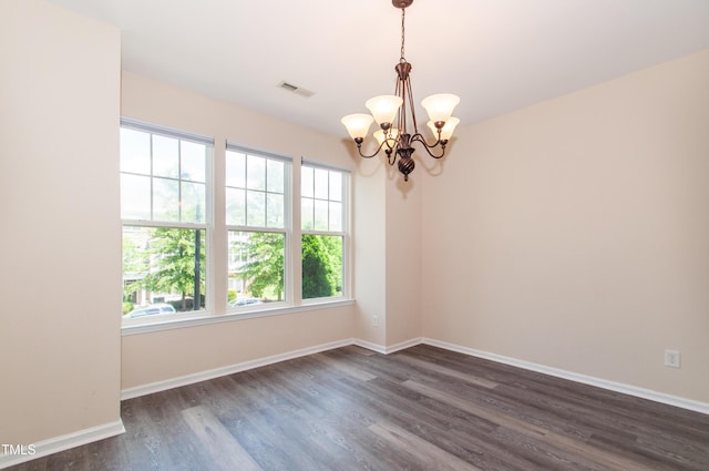 10119 Glen Autumn Rd, Raleigh, NC 27617 - spare room with dark wood-style floors and a chandelier