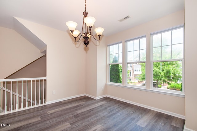 10119 Glen Autumn Rd, Raleigh, NC 27617 - empty room with a chandelier and wood finished floors
