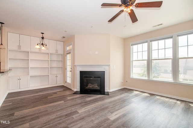 10119 Glen Autumn Rd, Raleigh, NC 27617 - unfurnished living room featuring dark wood-style floors, a fireplace with flush hearth, and ceiling fan