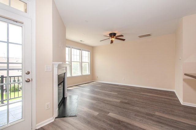 10119 Glen Autumn Rd, Raleigh, NC 27617 - spare room featuring ceiling fan, wood finished floors, and a glass covered fireplace