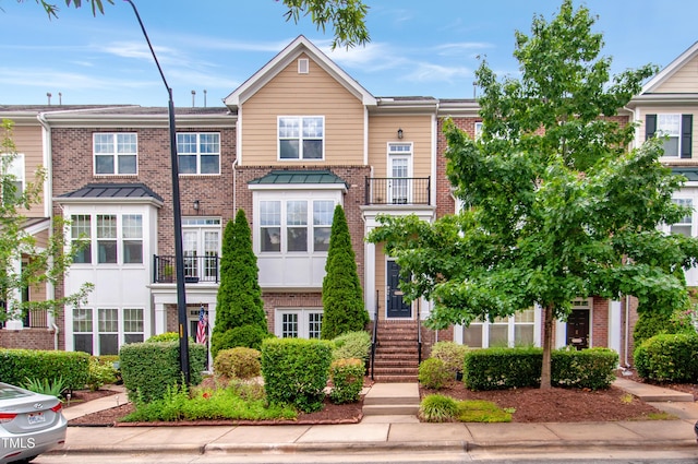10119 Glen Autumn Rd, Raleigh, NC 27617 - view of front of home featuring brick siding and stairs