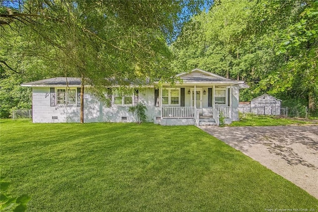 3211 Blossom Rd, Fayetteville, NC 28306 - view of front of house featuring a porch, crawl space, and a front yard