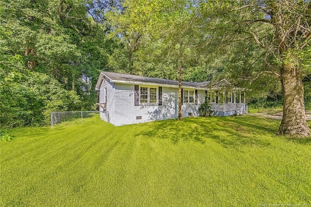 3211 Blossom Rd, Fayetteville, NC 28306 - view of side of property featuring covered porch, a view of trees, and concrete block siding
