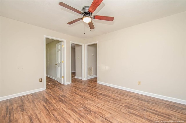 3211 Blossom Rd, Fayetteville, NC 28306 - empty room with wood finished floors and a ceiling fan