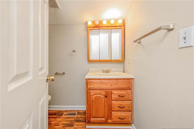 3211 Blossom Rd, Fayetteville, NC 28306 - bathroom with vanity and wood finished floors