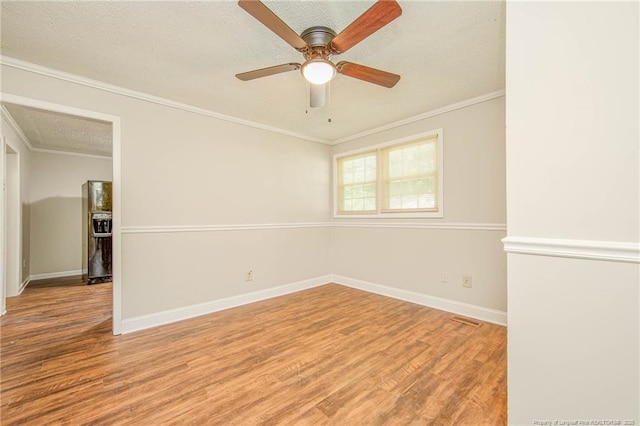 3211 Blossom Rd, Fayetteville, NC 28306 - empty room featuring wood finished floors, a textured ceiling, crown molding, and a ceiling fan