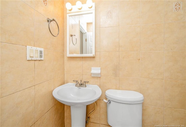 3211 Blossom Rd, Fayetteville, NC 28306 - half bath featuring tile walls and toilet
