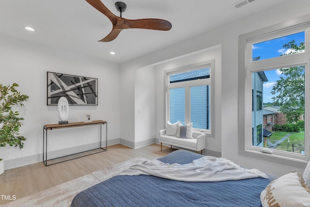 1000 Addison Pl Unit 101, Raleigh, NC 27610 - bedroom featuring wood finished floors, multiple windows, recessed lighting, and ceiling fan
