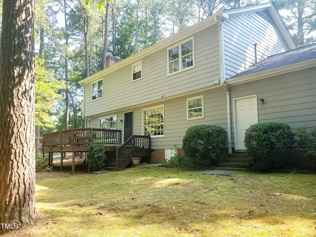 6115 Winthrop Dr, Raleigh, NC 27612 - back of house featuring a deck, a lawn, and a chimney