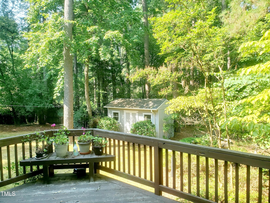 6115 Winthrop Dr, Raleigh, NC 27612 - deck featuring a storage shed