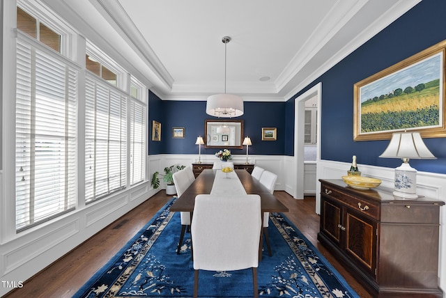 2153 Princeville Dr, Apex, NC 27523 - dining room featuring healthy amount of natural light, wood finished floors, a tray ceiling, wainscoting, and ornamental molding