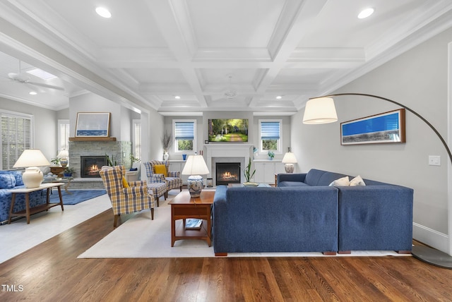 2153 Princeville Dr, Apex, NC 27523 - living area with a fireplace, wood finished floors, beam ceiling, recessed lighting, and ornamental molding