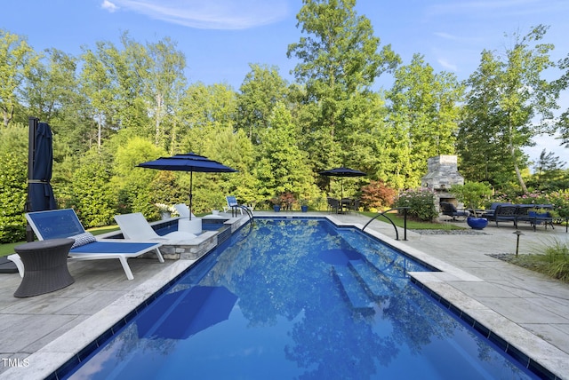 2153 Princeville Dr, Apex, NC 27523 - outdoor pool featuring an outdoor stone fireplace and a patio
