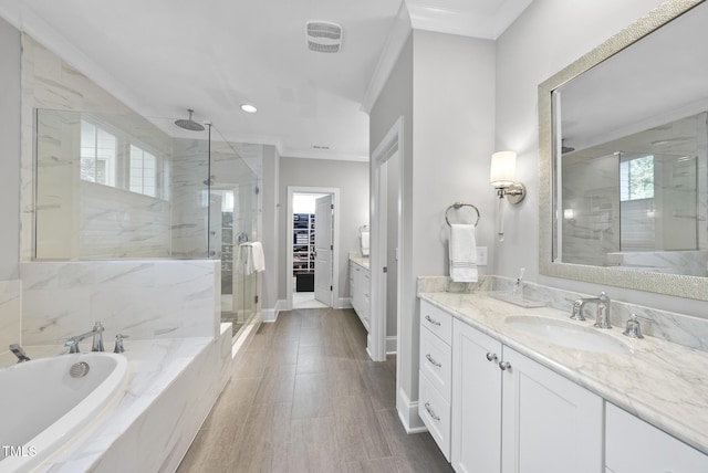 2153 Princeville Dr, Apex, NC 27523 - full bathroom featuring a marble finish shower, crown molding, vanity, a garden tub, and a walk in closet