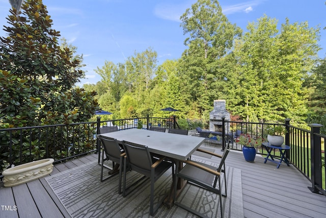 2153 Princeville Dr, Apex, NC 27523 - wooden terrace featuring an outdoor stone fireplace and outdoor dining area