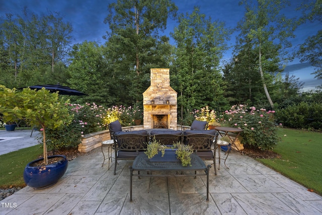 2153 Princeville Dr, Apex, NC 27523 - view of patio / terrace featuring an outdoor stone fireplace