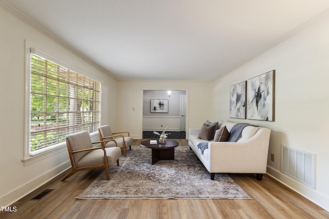4009 Pepperton Dr, Raleigh, NC 27606 - living area featuring wood finished floors and crown molding