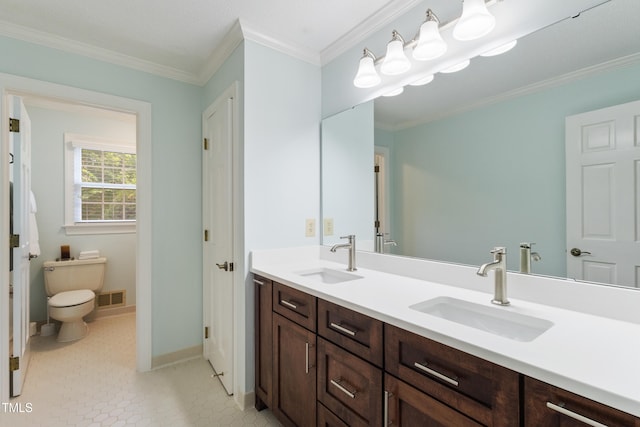 4009 Pepperton Dr, Raleigh, NC 27606 - bathroom with double vanity, crown molding, and tile patterned flooring