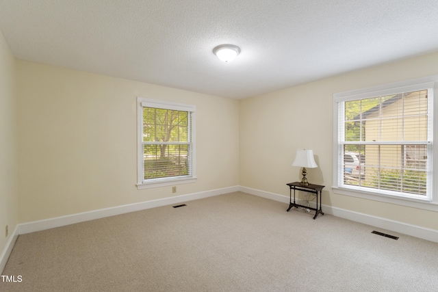 4009 Pepperton Dr, Raleigh, NC 27606 - empty room featuring light colored carpet and a textured ceiling