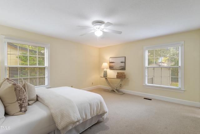 4009 Pepperton Dr, Raleigh, NC 27606 - carpeted bedroom with baseboards and ceiling fan