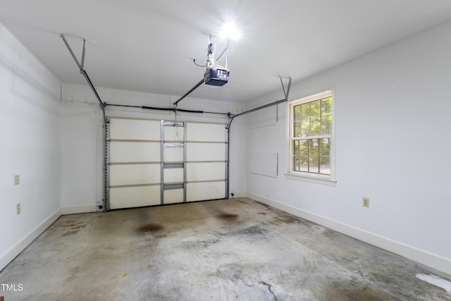 4009 Pepperton Dr, Raleigh, NC 27606 - garage featuring a garage door opener and baseboards