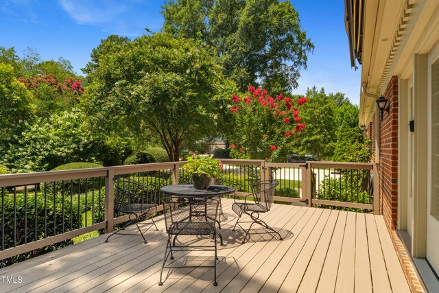 4009 Pepperton Dr, Raleigh, NC 27606 - wooden deck featuring outdoor dining space